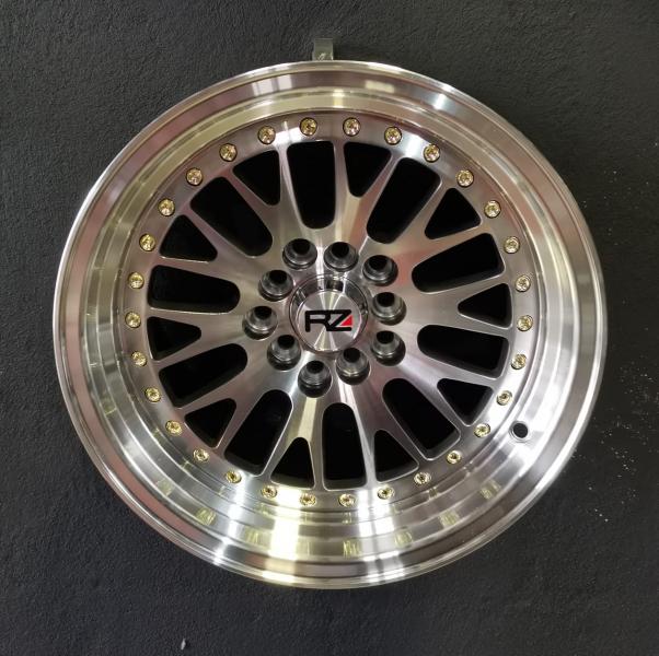 ARO 15X8 (L215) 5/100/114. Hyper black and machine face and lip with gold rivets (SET 4 AROS)