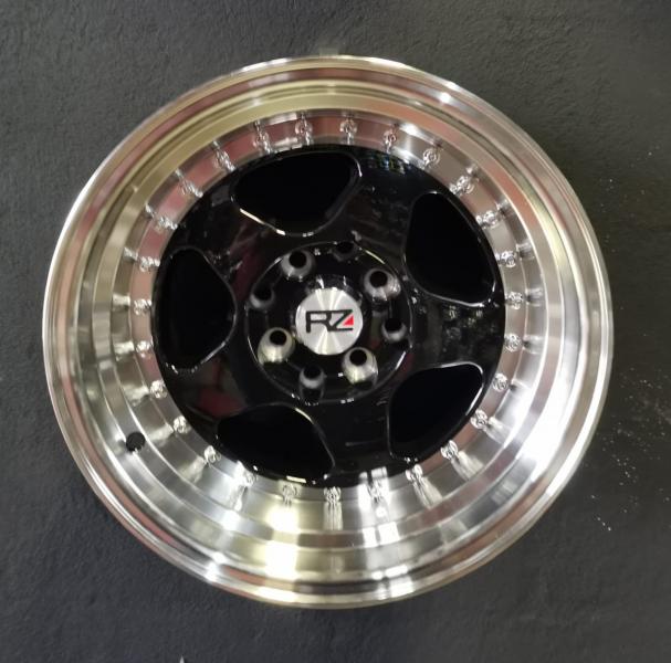 ARO 15X8.5 (L1569) 4/100/114.3 Black and machine lip with chrome rivts (SET 4 AROS)
